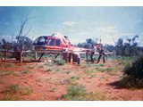 1968 : Protecting damaged helicopter VH-UHD in July with fencing (L-R) Paul McCormack and Lawrie O'Connor.